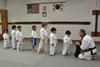 karate students line up for kicking exercise